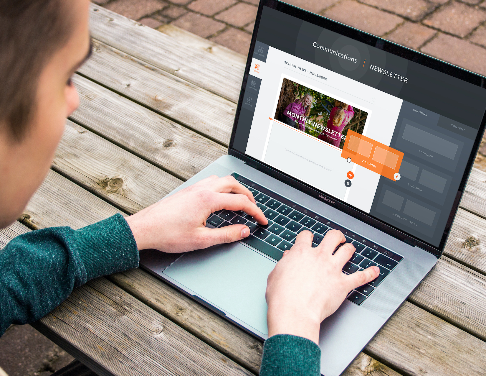 Boy on Macbook looking at digital newsletter builder